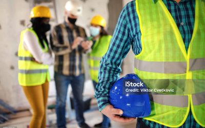 Group of engineers talking about performing work
